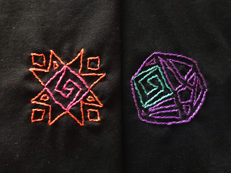 Hand stiched Tee-shirt by Akira. The designs represent the sun (left) and the moon (right)